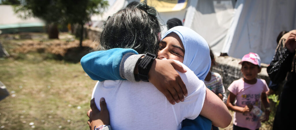 Two girls hugging each other