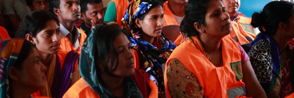 Group of women sitting together and listening to someone speak