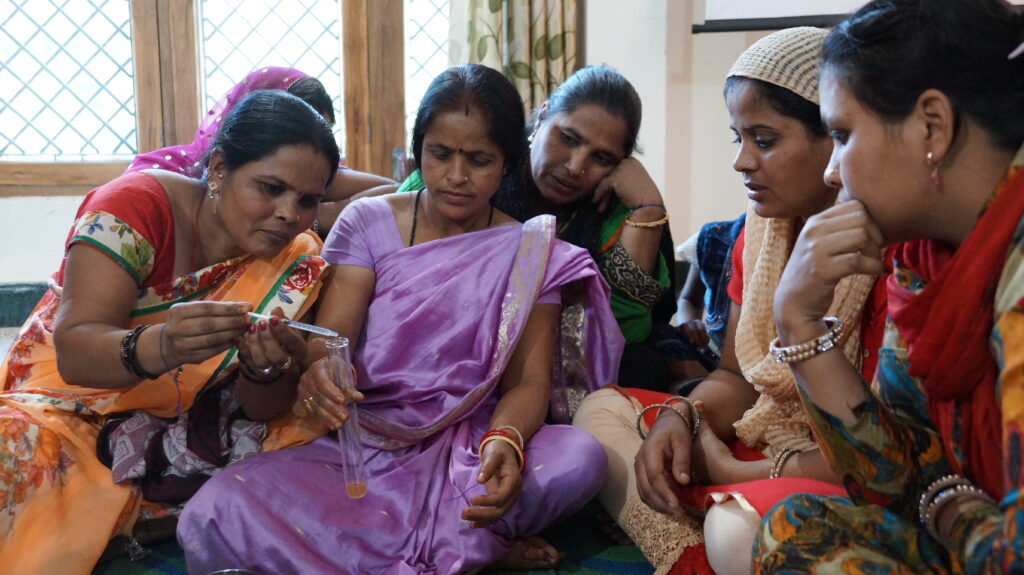 A group of women testing water in India