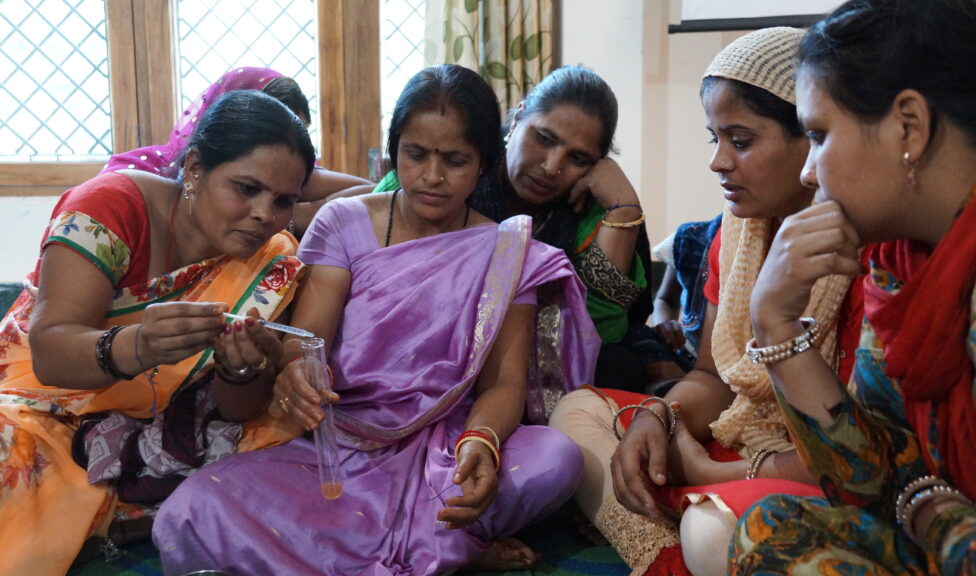 A group of women testing water in India